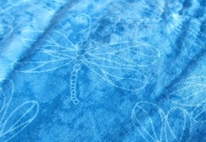 This almost reads as a solid, but there are little dragonflies up close. Love it.